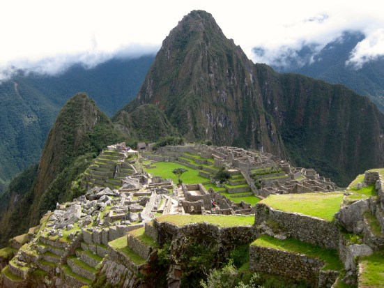 Fog has cleared for the moment as the sun shines on Machu Picchu.
